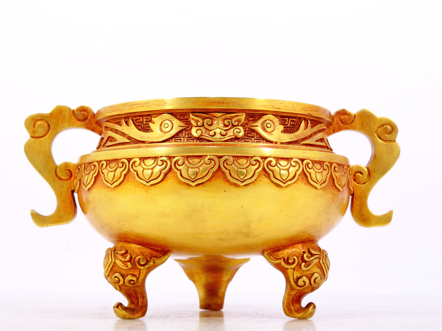 An exquisite gilt bronze censer with double ears and three legs