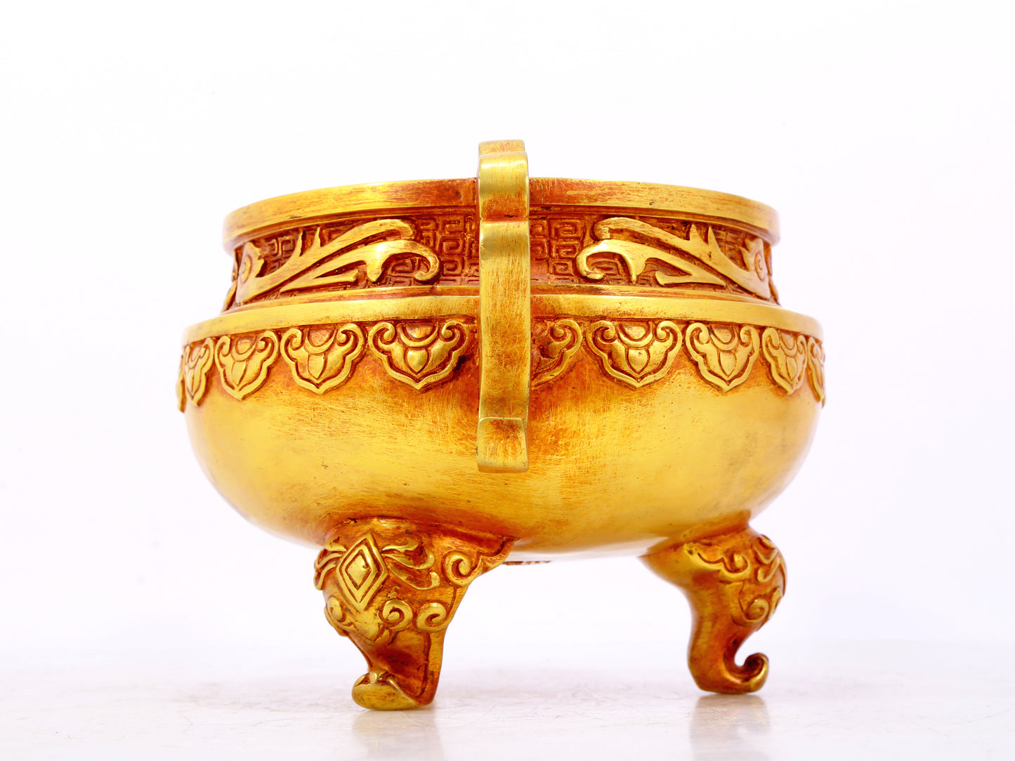 An exquisite gilt bronze censer with double ears and three legs