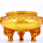 An exquisite gilt bronze lion-eared tripod censer