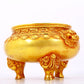 An exquisite gilt bronze lion-eared tripod censer