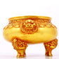 An exquisite gilt bronze lion-eared tripod censer