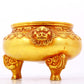 An exquisite gilt bronze lion-eared tripod censer