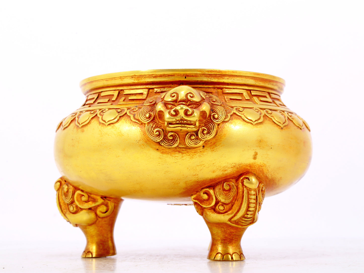 An exquisite gilt bronze lion-eared tripod censer