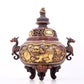 An exquisite gilt bronze censer with double ears and three legs with a lion and dragon pattern and a lid