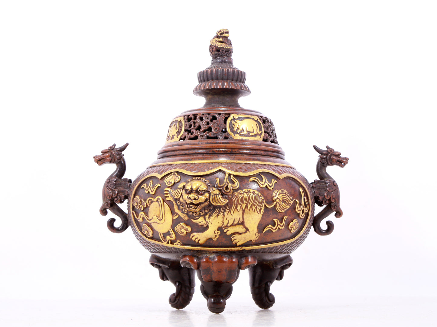 An exquisite gilt bronze censer with double ears and three legs with a lion and dragon pattern and a lid