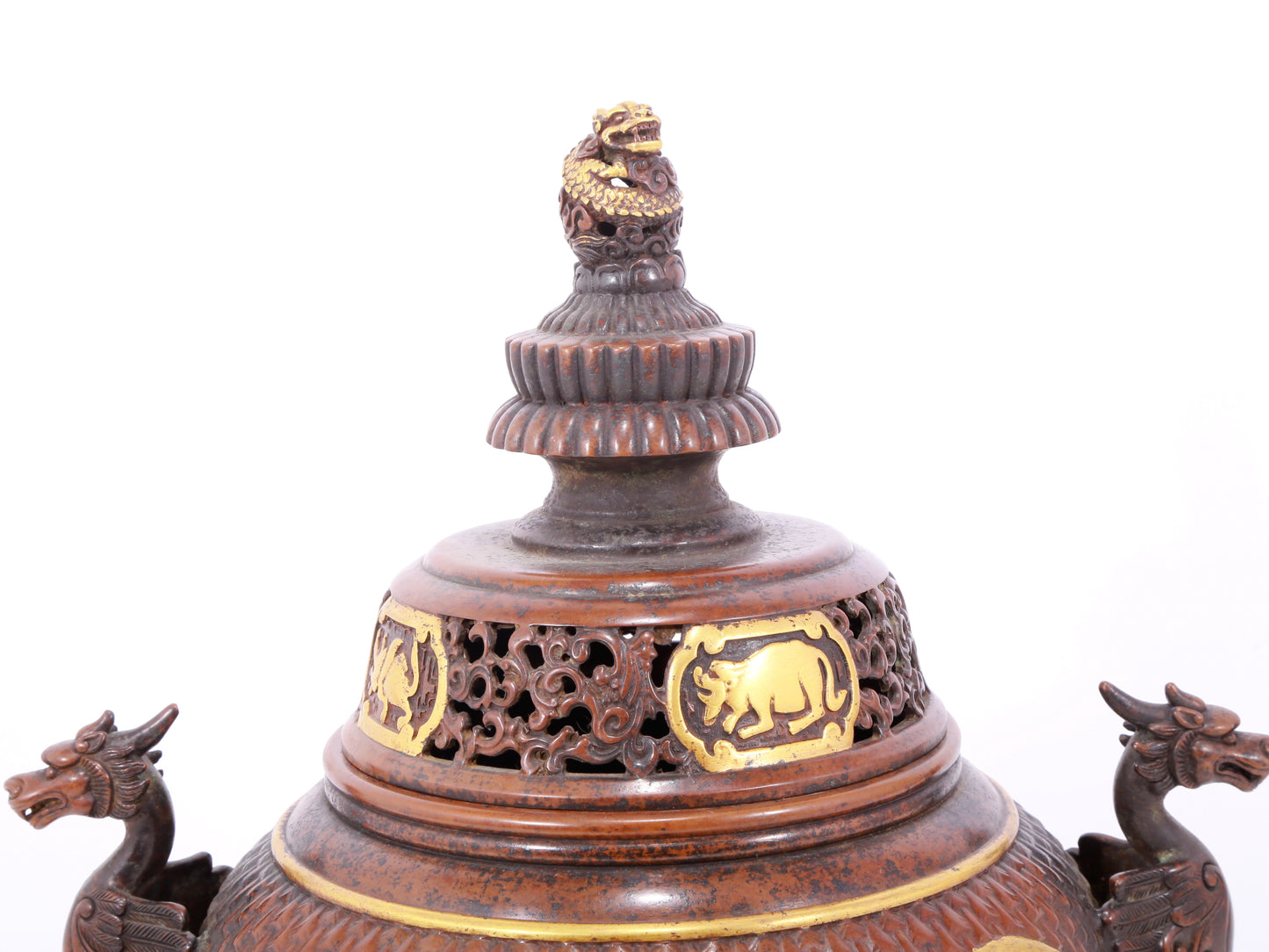 An exquisite gilt bronze censer with double ears and three legs with a lion and dragon pattern and a lid