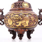 An exquisite gilt bronze censer with double ears and three legs with a lion and dragon pattern and a lid