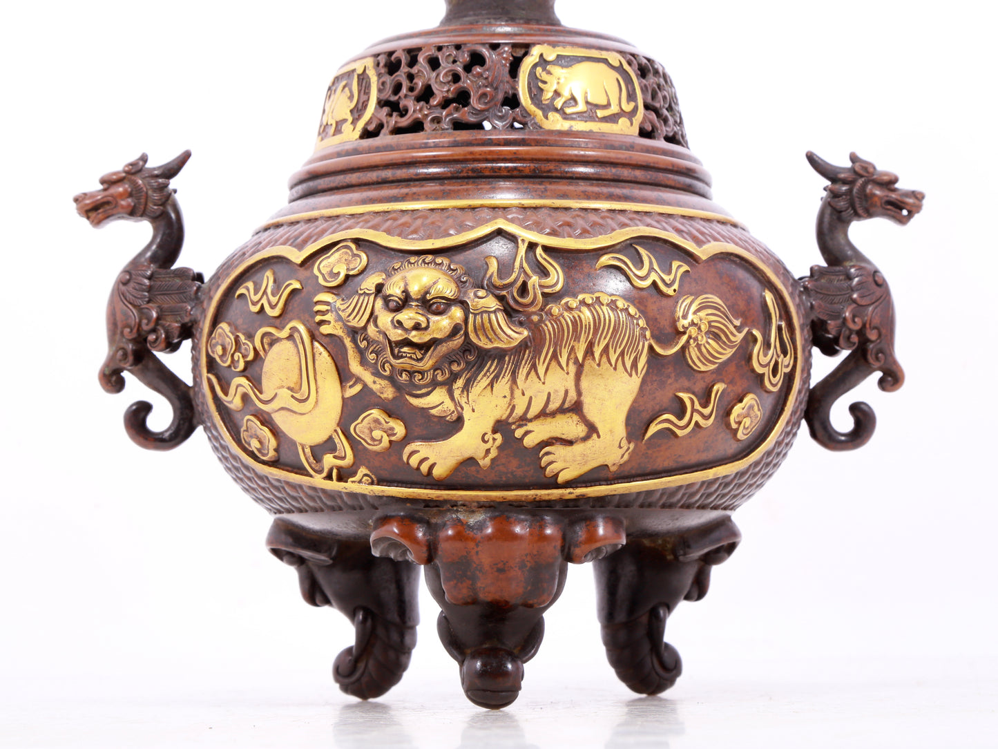 An exquisite gilt bronze censer with double ears and three legs with a lion and dragon pattern and a lid