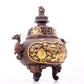 An exquisite gilt bronze censer with double ears and three legs with a lion and dragon pattern and a lid