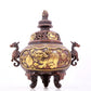 An exquisite gilt bronze censer with double ears and three legs with a lion and dragon pattern and a lid