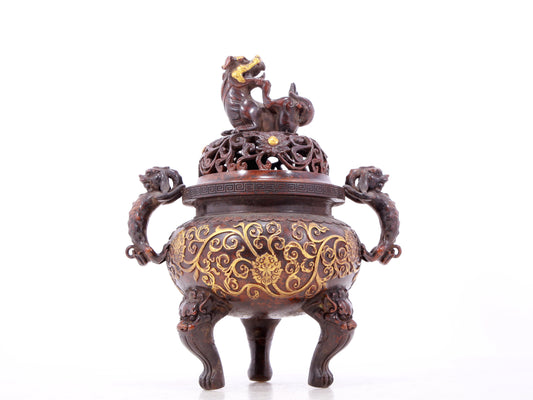 An exquisite gilt bronze censer with double ears and three legs with lotus and auspicious animal patterns.