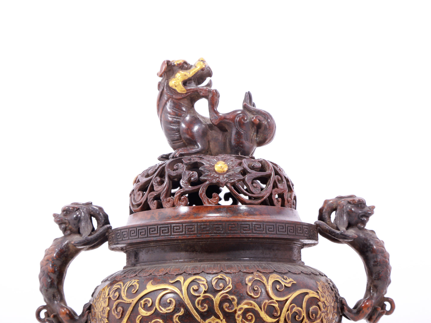 An exquisite gilt bronze censer with double ears and three legs with lotus and auspicious animal patterns.