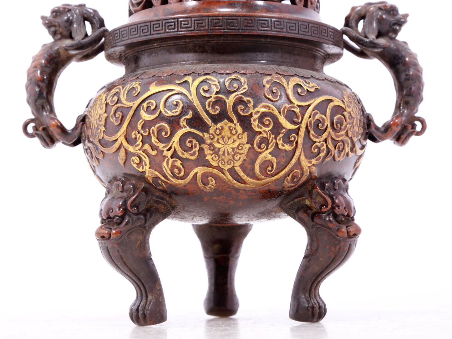 An exquisite gilt bronze censer with double ears and three legs with lotus and auspicious animal patterns.