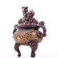 An exquisite gilt bronze censer with double ears and three legs with lotus and auspicious animal patterns.