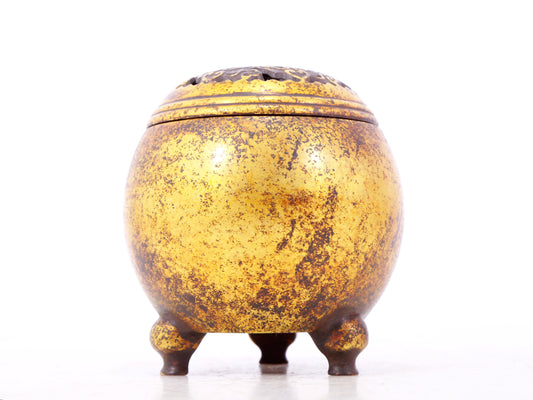 An exquisite gilt bronze tripod censer with lid