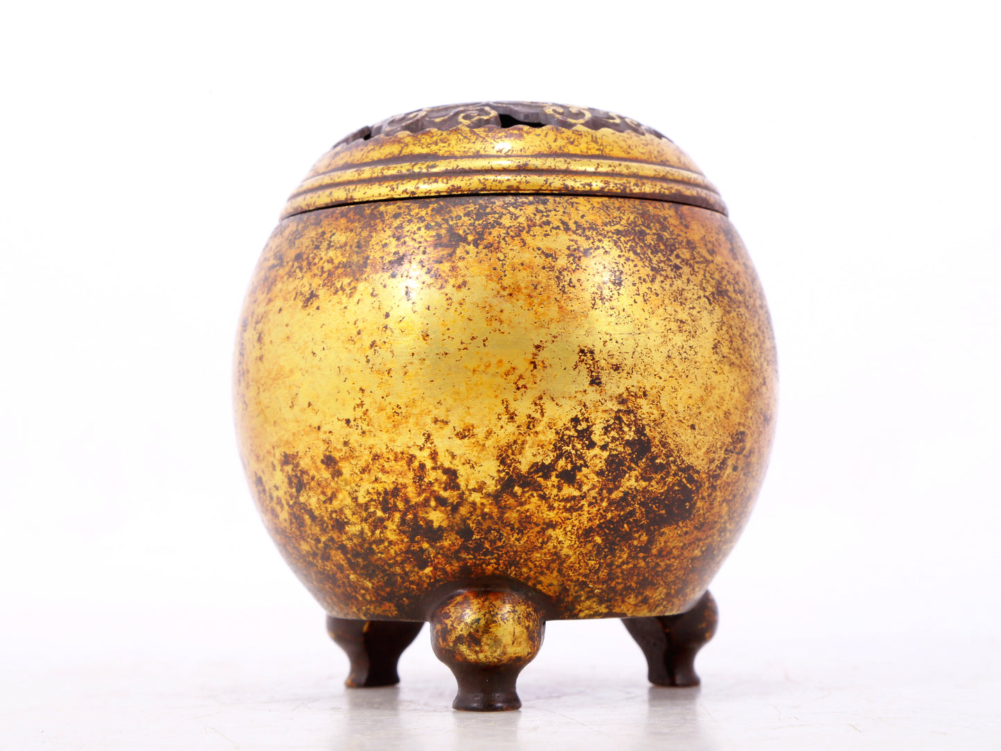 An exquisite gilt bronze tripod censer with lid