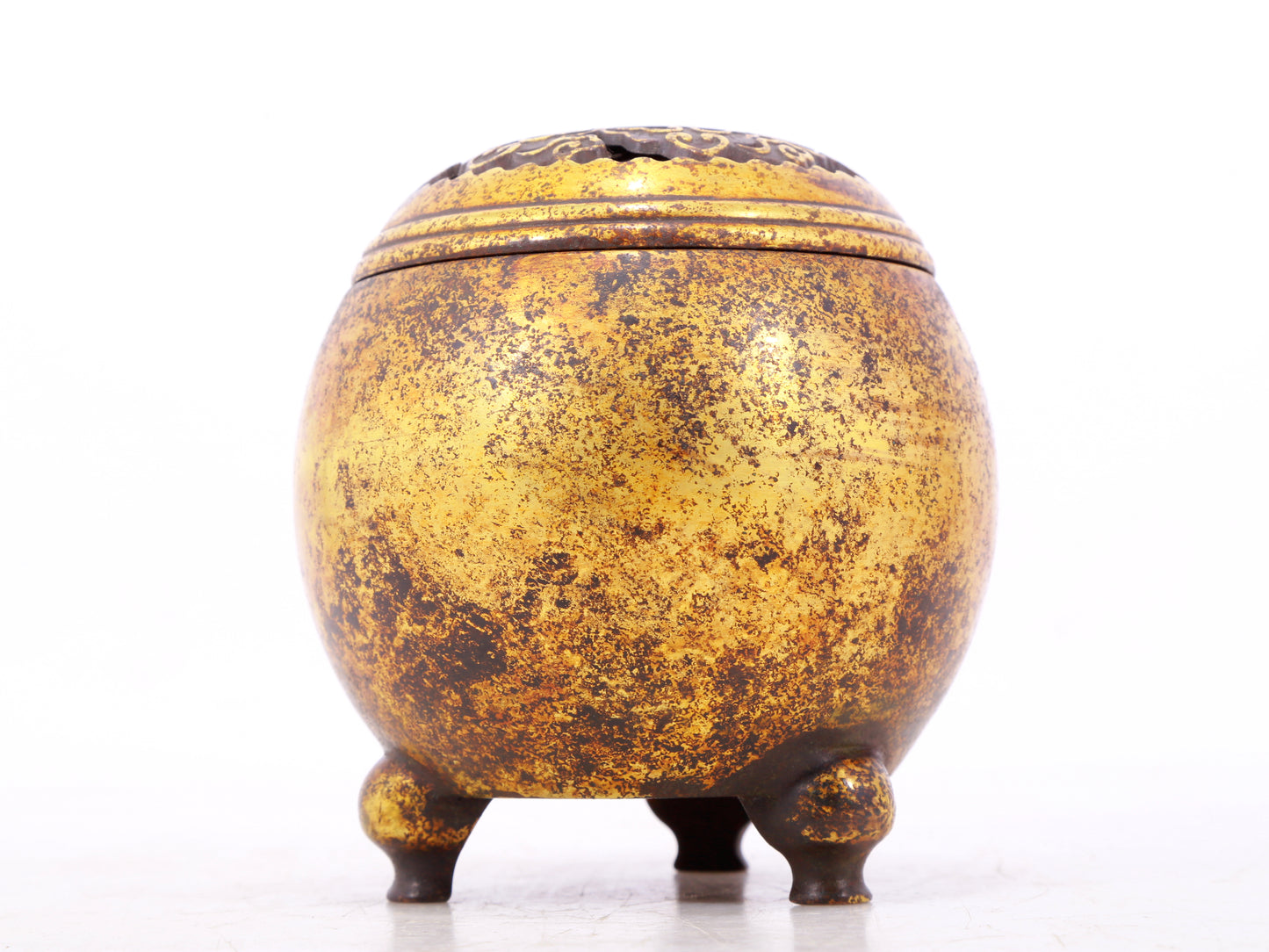 An exquisite gilt bronze tripod censer with lid