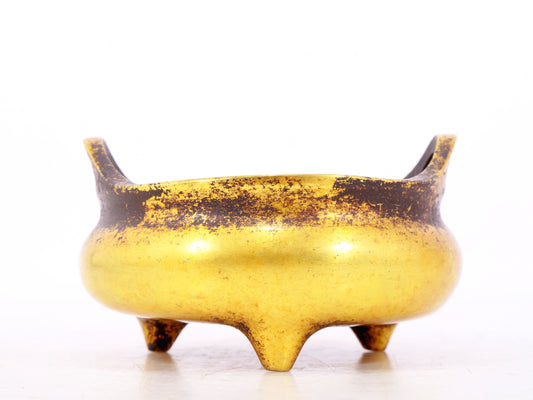 An exquisite gilt bronze censer with double ears and three legs