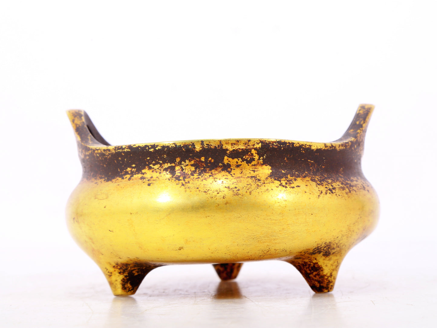 An exquisite gilt bronze censer with double ears and three legs