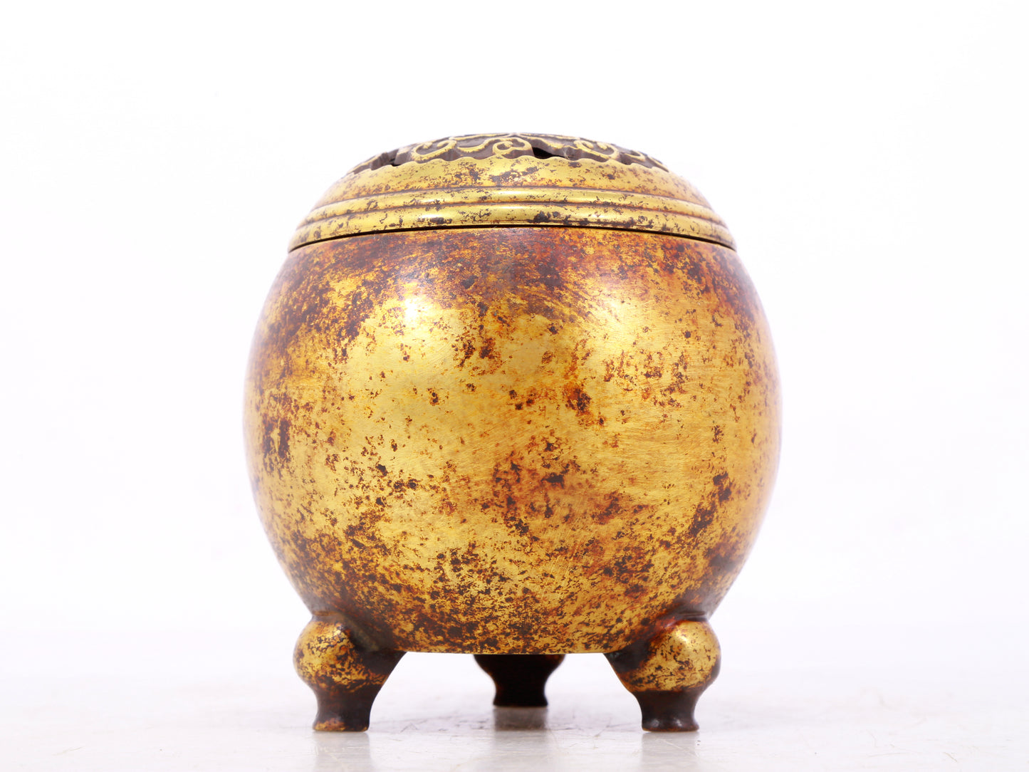 An exquisite gilt bronze tripod censer with lid