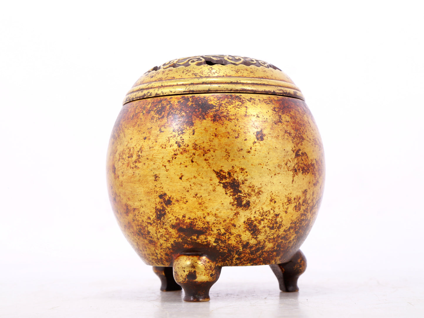 An exquisite gilt bronze tripod censer with lid