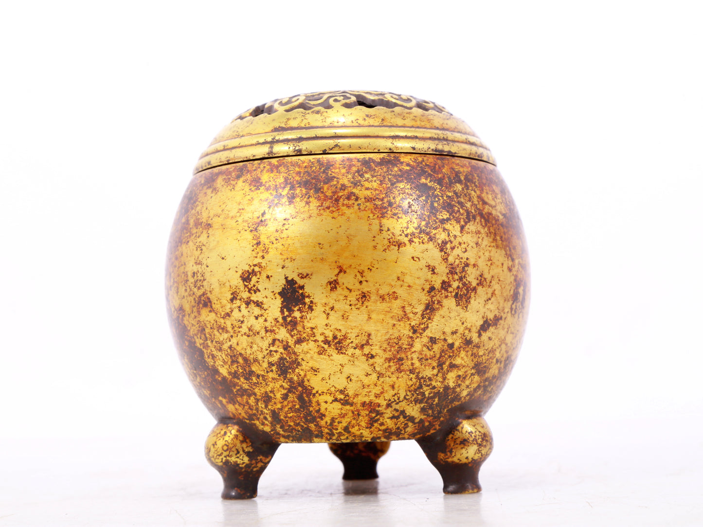 An exquisite gilt bronze tripod censer with lid