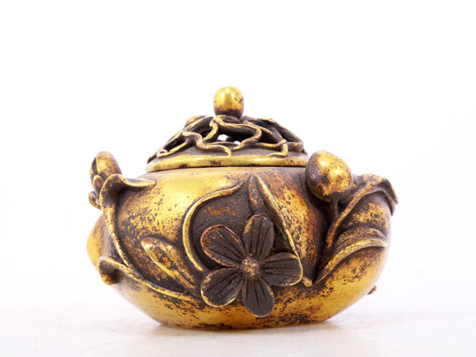 An exquisite gilt bronze censer with floral pattern and lid