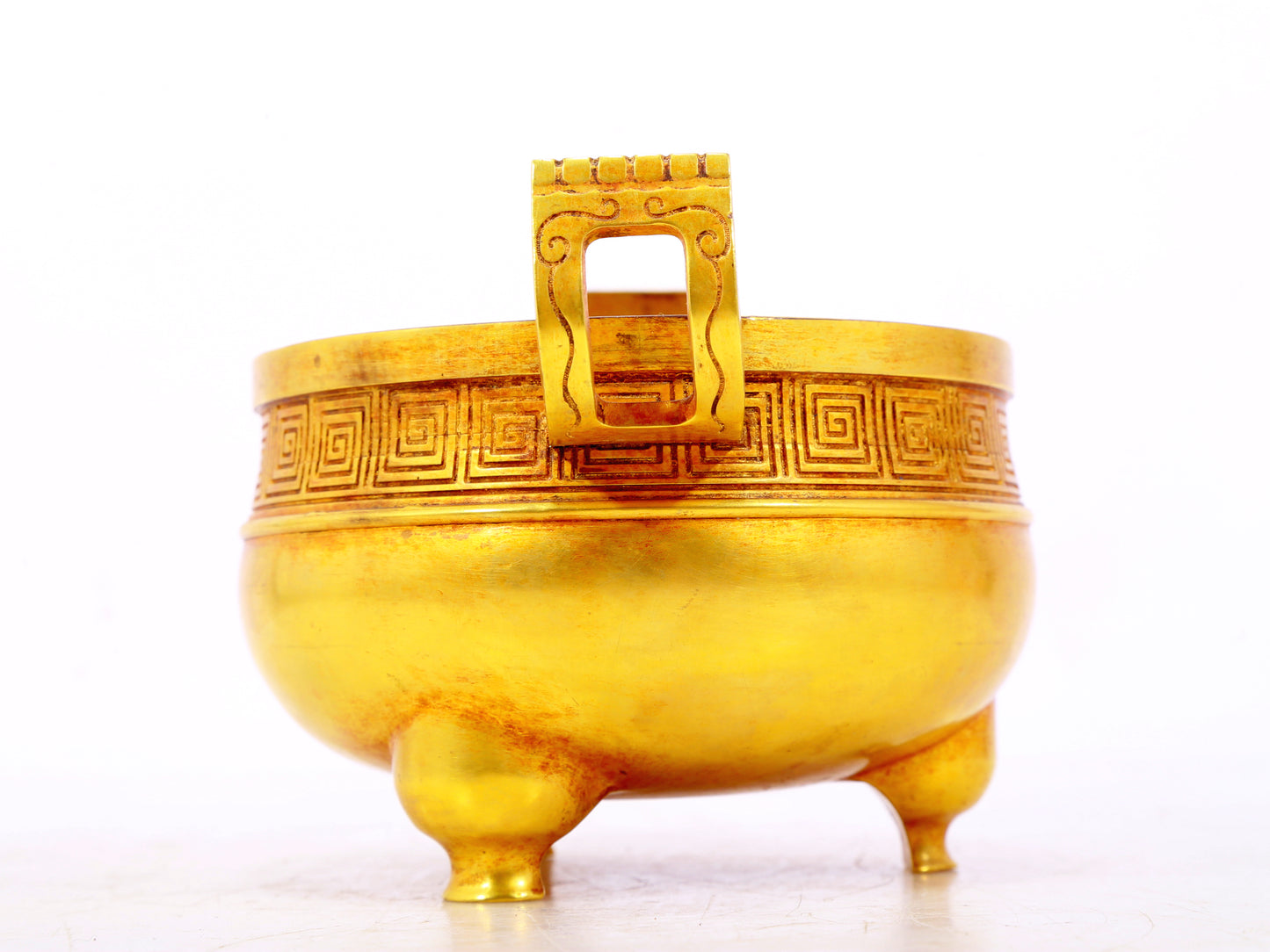 An exquisite gilt bronze censer with double ears and three legs