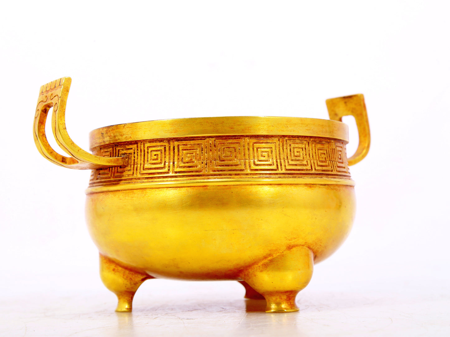 An exquisite gilt bronze censer with double ears and three legs