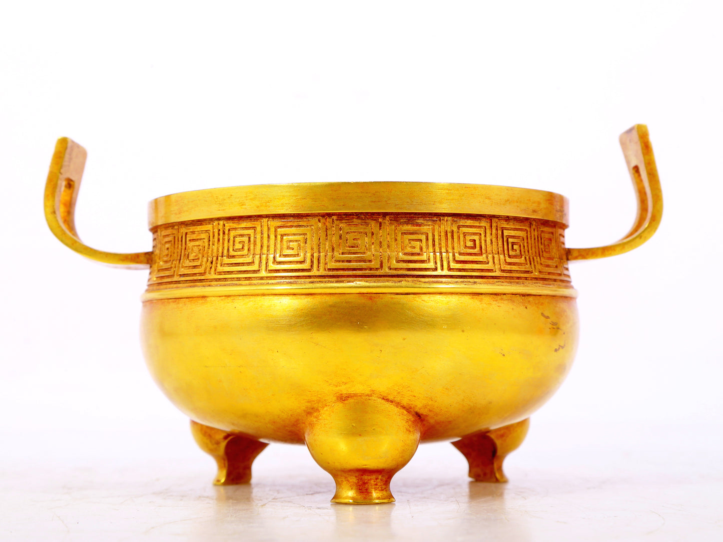 An exquisite gilt bronze censer with double ears and three legs