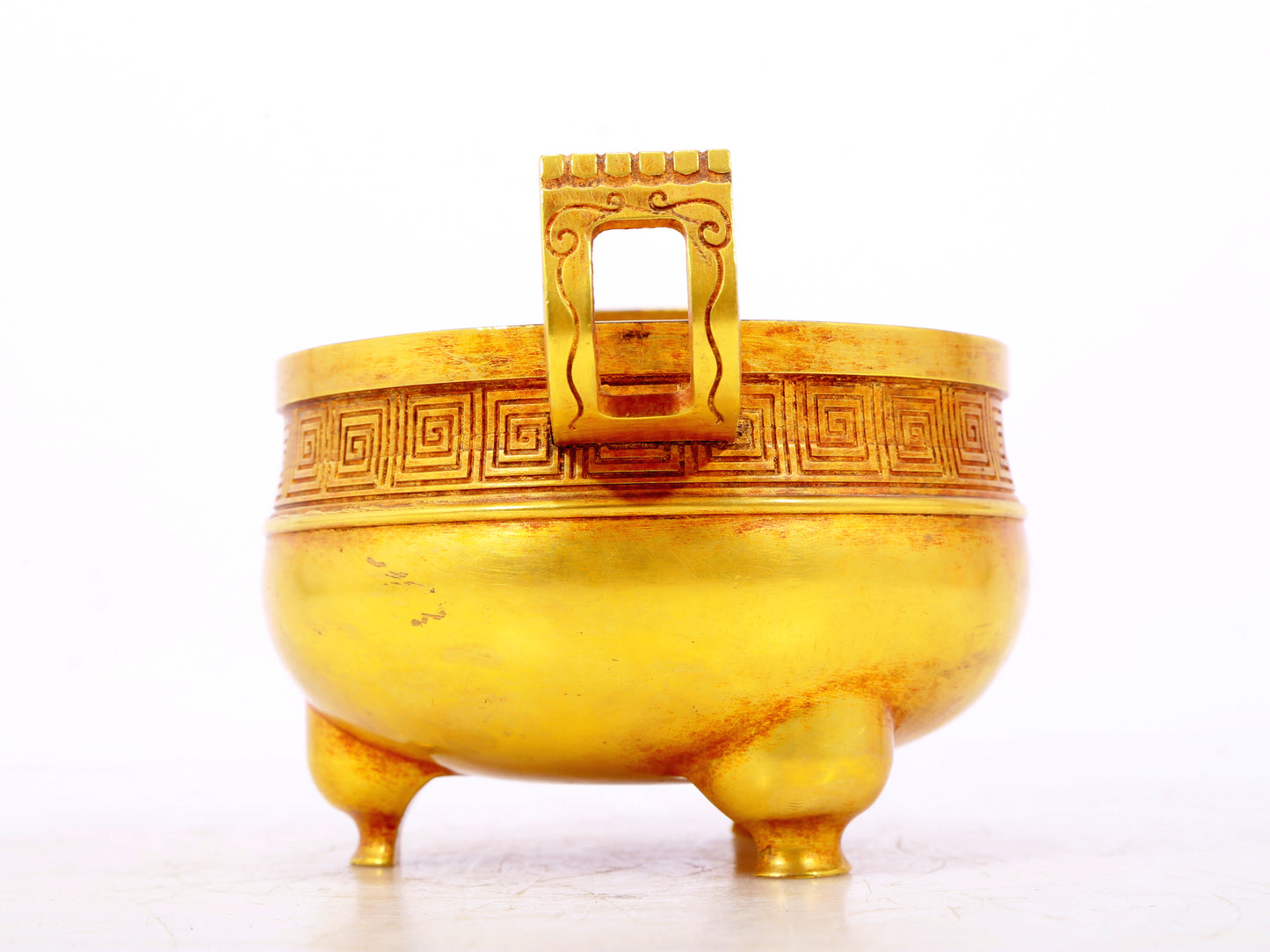 An exquisite gilt bronze censer with double ears and three legs