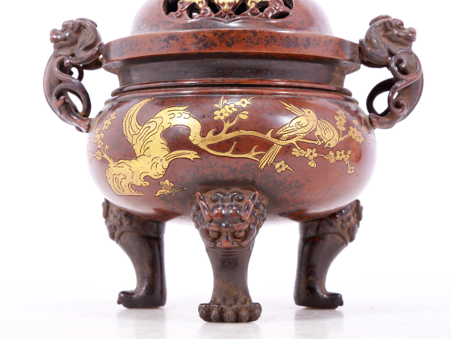 An exquisite gilt bronze double-eared and tripod censer with flower and bird patterns and lid