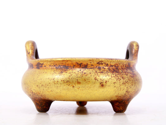 An exquisite gilt bronze censer with double ears and three legs