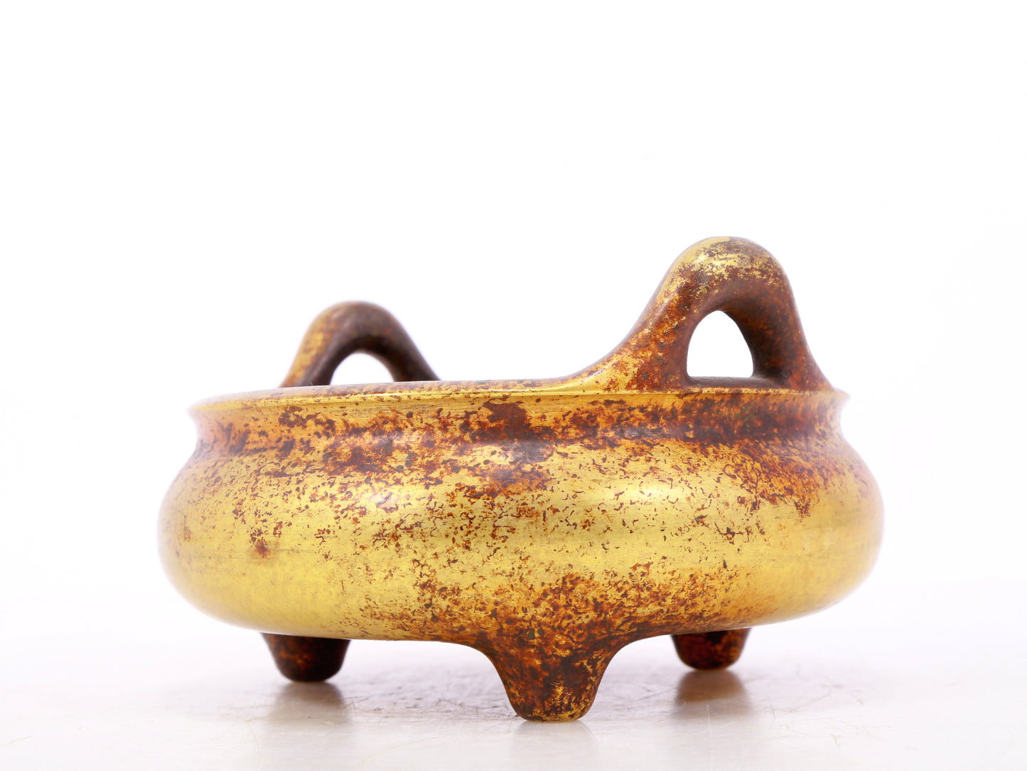 An exquisite gilt bronze censer with double ears and three legs