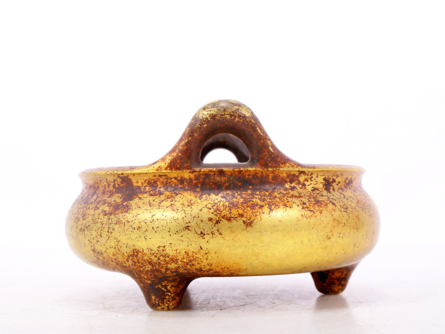 An exquisite gilt bronze censer with double ears and three legs