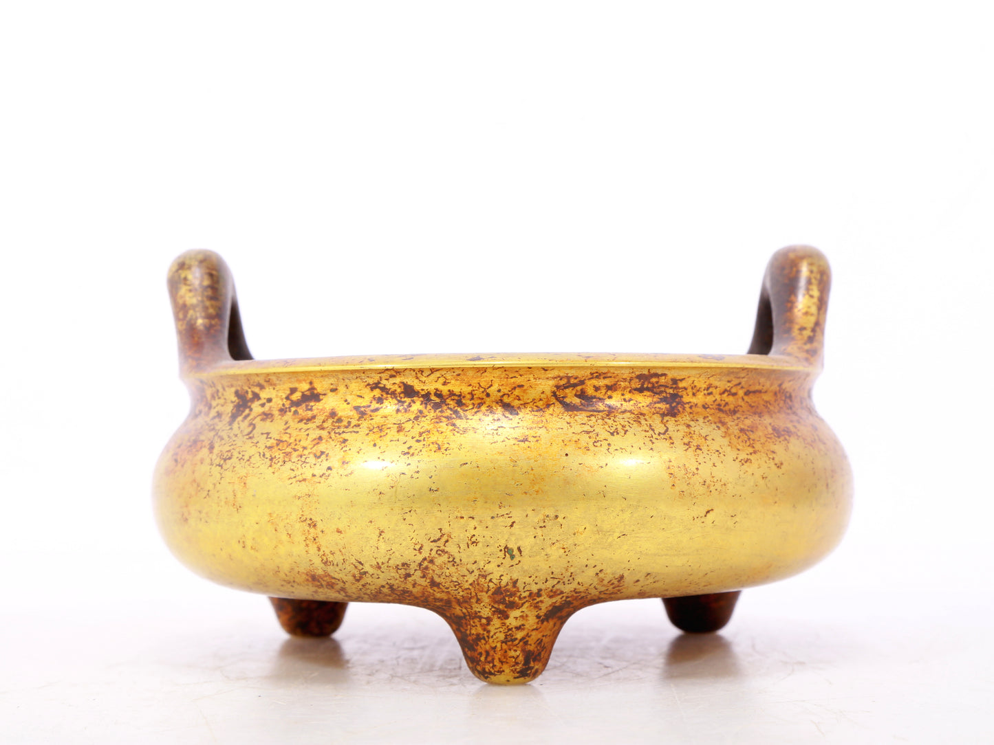 An exquisite gilt bronze censer with double ears and three legs