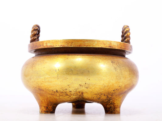 An exquisite gilt bronze censer with double ears and three legs