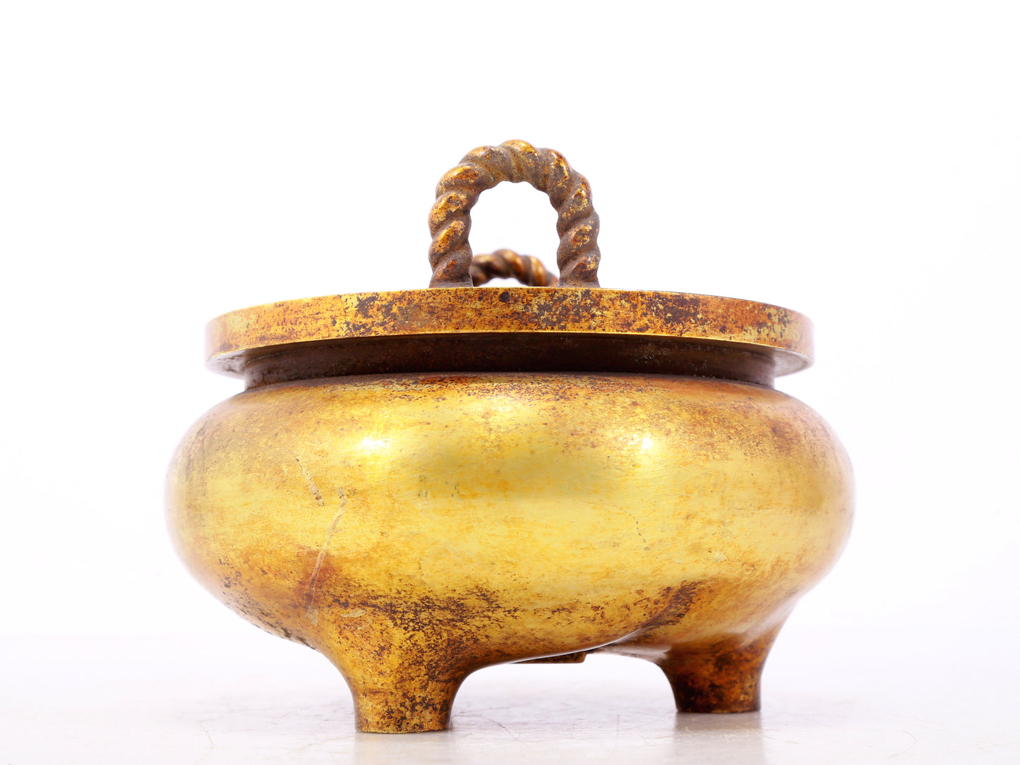 An exquisite gilt bronze censer with double ears and three legs