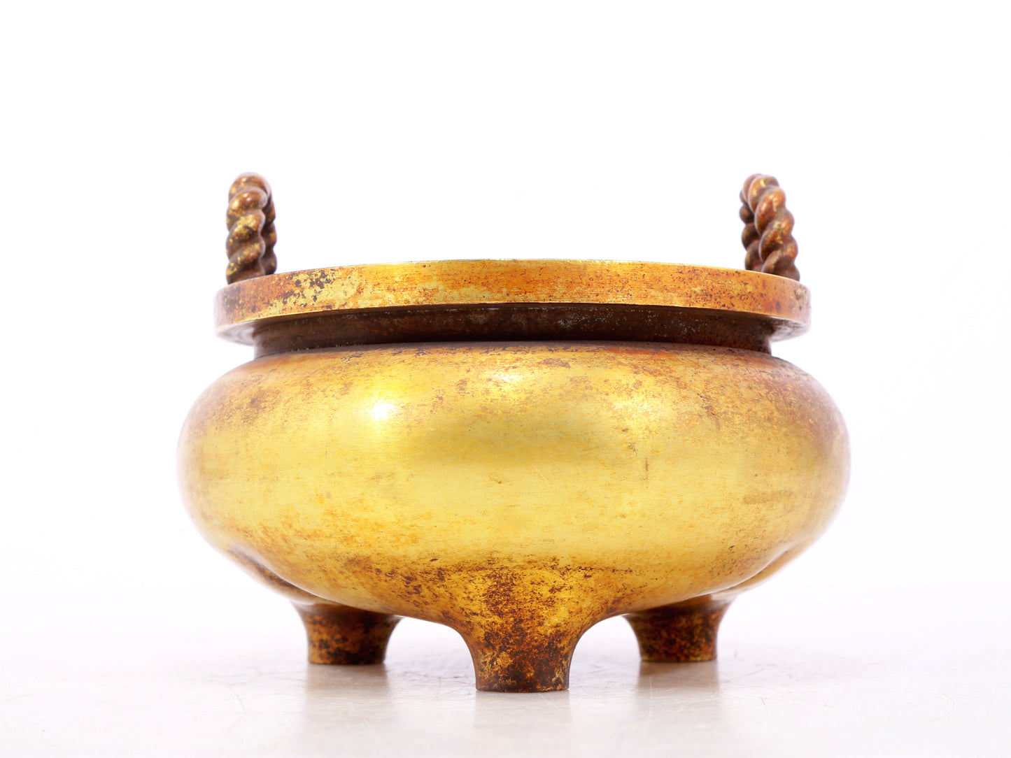 An exquisite gilt bronze censer with double ears and three legs