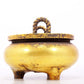 An exquisite gilt bronze censer with double ears and three legs