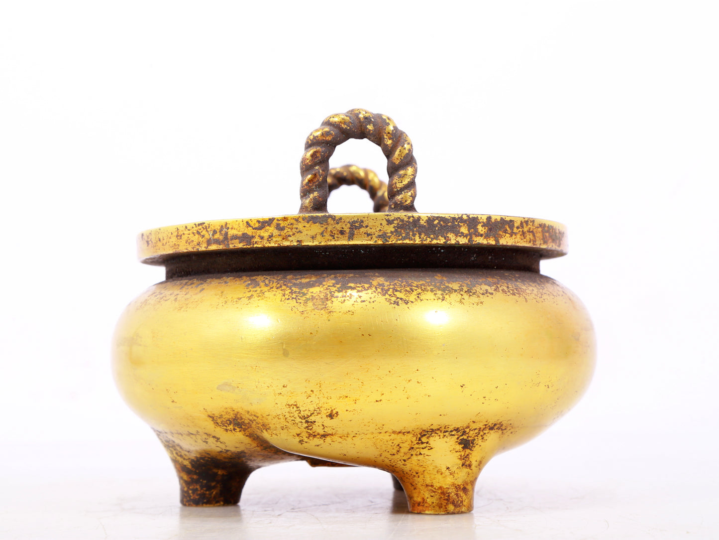 An exquisite gilt bronze censer with double ears and three legs