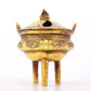 An exquisite gilt bronze censer with double ears and three legs with auspicious animal patterns and a lid