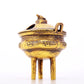 An exquisite gilt bronze censer with double ears and three legs with auspicious animal patterns and a lid