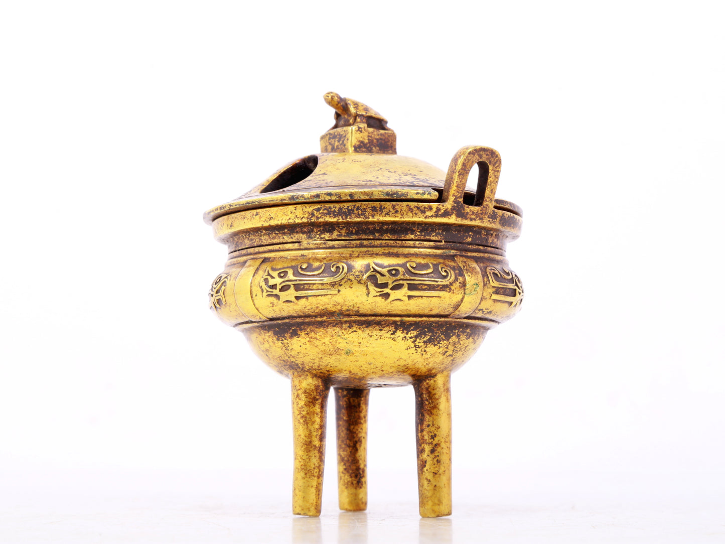 An exquisite gilt bronze censer with double ears and three legs with auspicious animal patterns and a lid