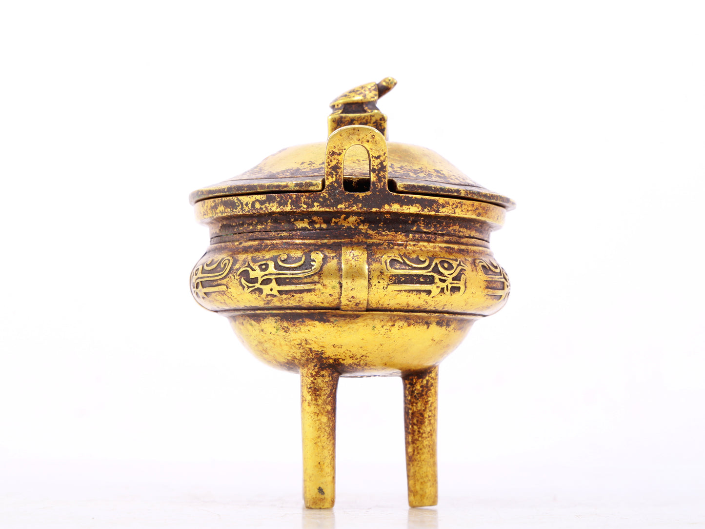 An exquisite gilt bronze censer with double ears and three legs with auspicious animal patterns and a lid