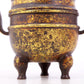 An exquisite gilt bronze dragon-patterned double-eared and tripod censer with lid