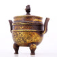 An exquisite gilt bronze dragon-patterned double-eared and tripod censer with lid