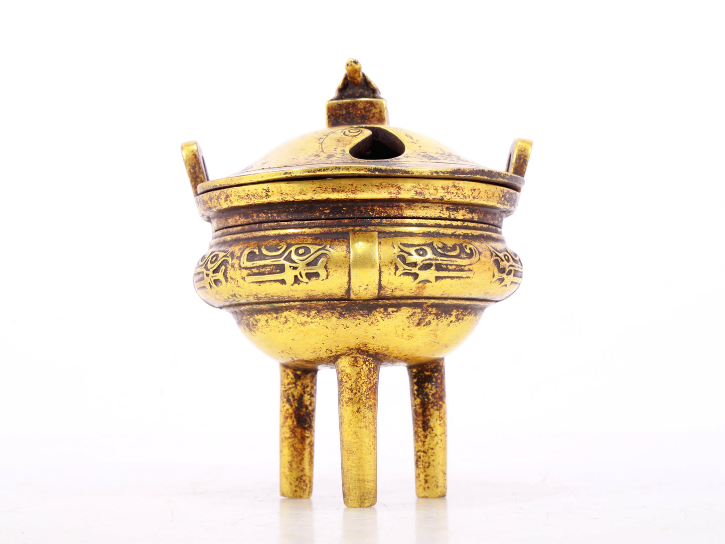 An exquisite gilt bronze censer with double ears and three legs with auspicious animal patterns and a lid