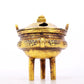 An exquisite gilt bronze censer with double ears and three legs with auspicious animal patterns and a lid