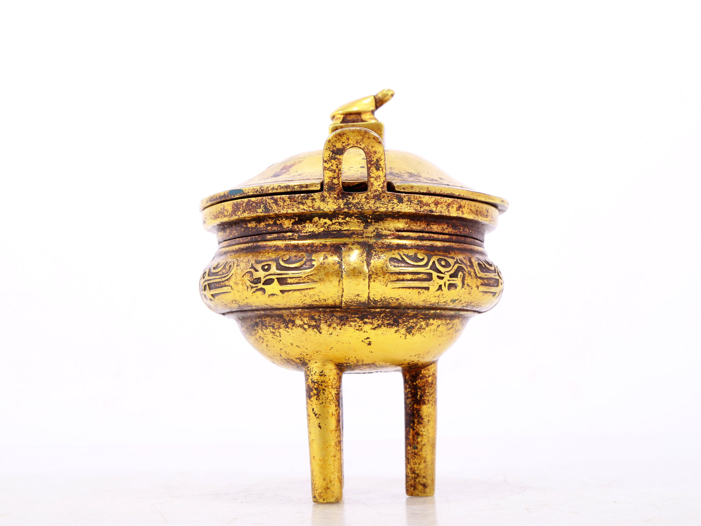 An exquisite gilt bronze censer with double ears and three legs with auspicious animal patterns and a lid